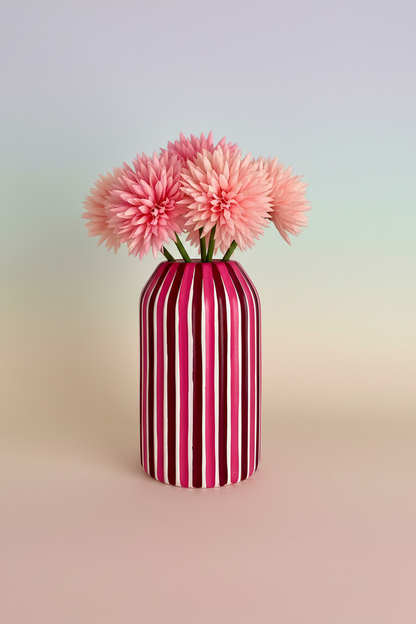 A pink and plum hand painted striped ceramic vase 