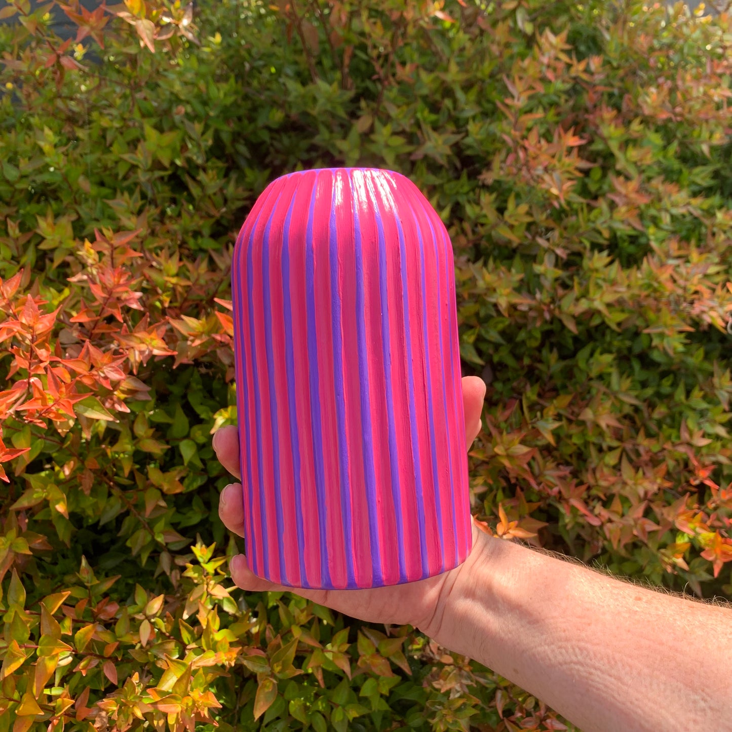 Purple and fuchsia hand painted striped ceramic vase