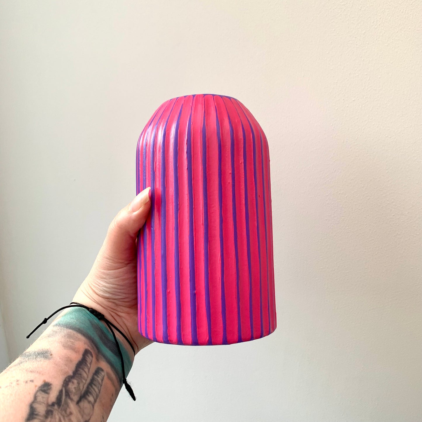 Purple and fuchsia hand painted striped ceramic vase