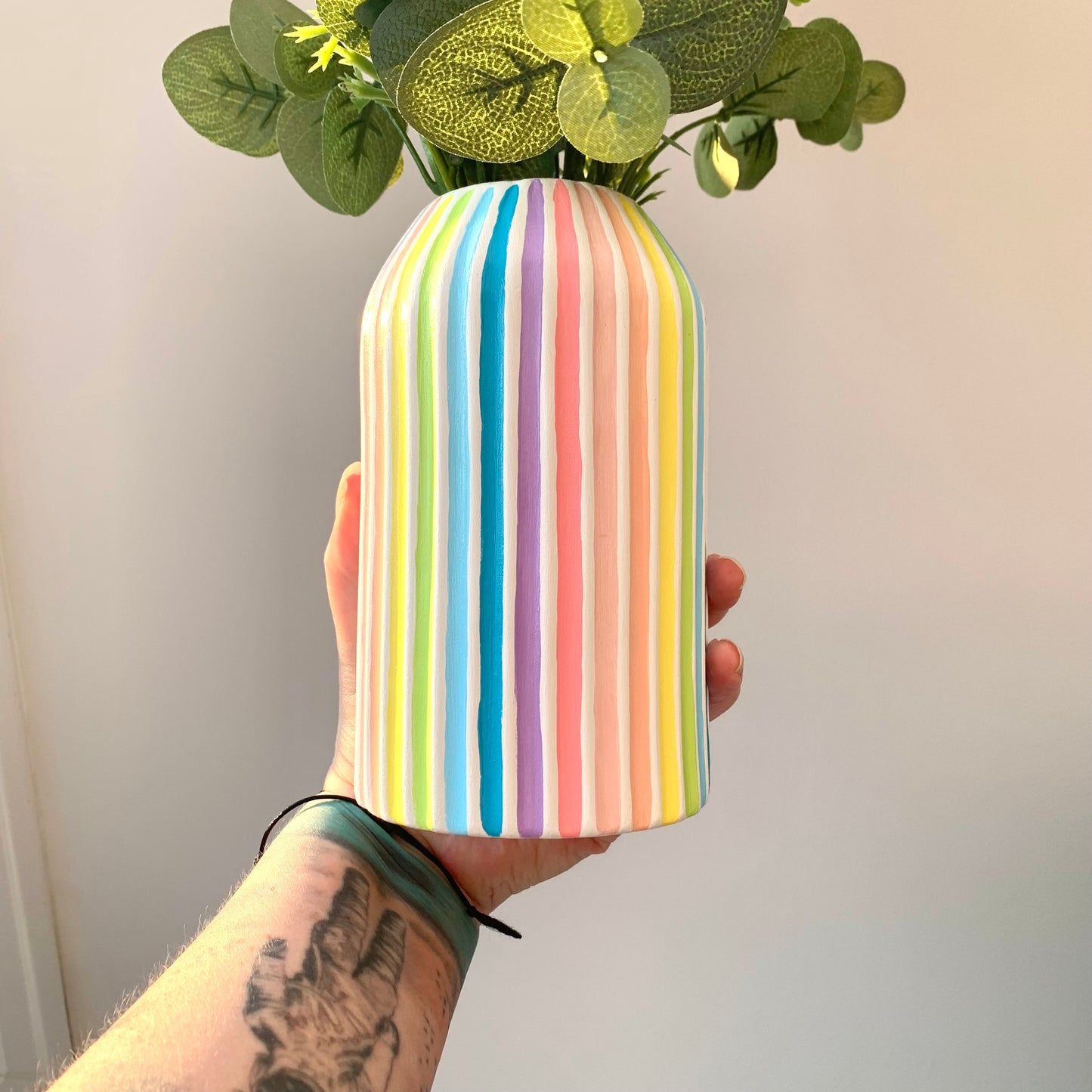 Multicoloured pastel striped rainbow ceramic vase 