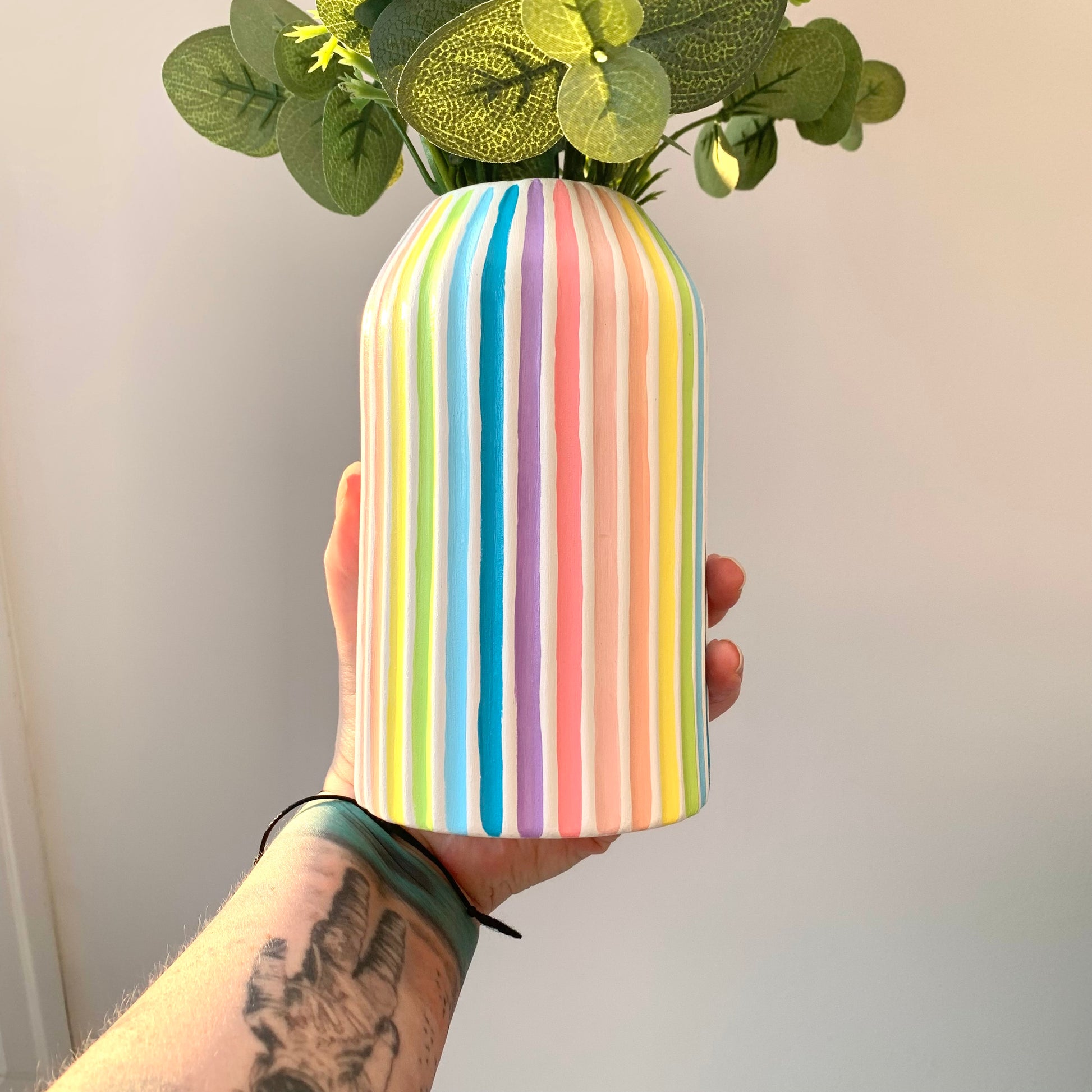 Multicoloured pastel striped rainbow ceramic vase 
